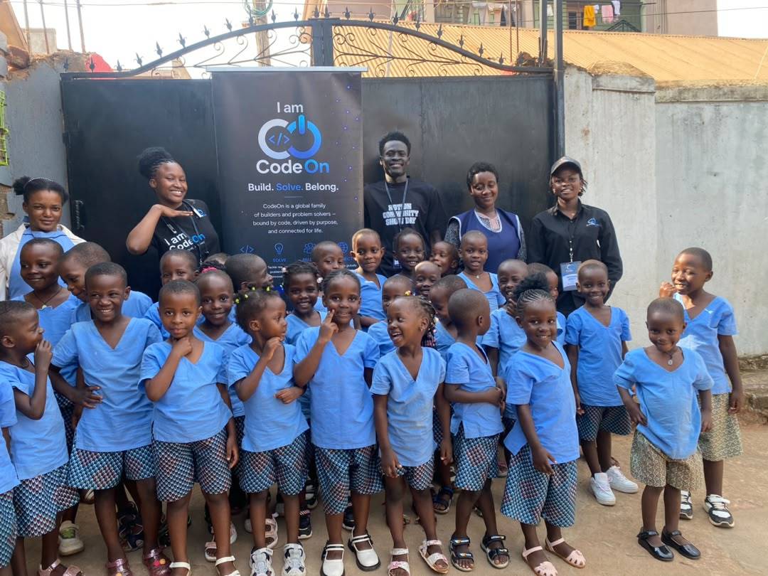 A full class in blue uniforms with the CodeOn team