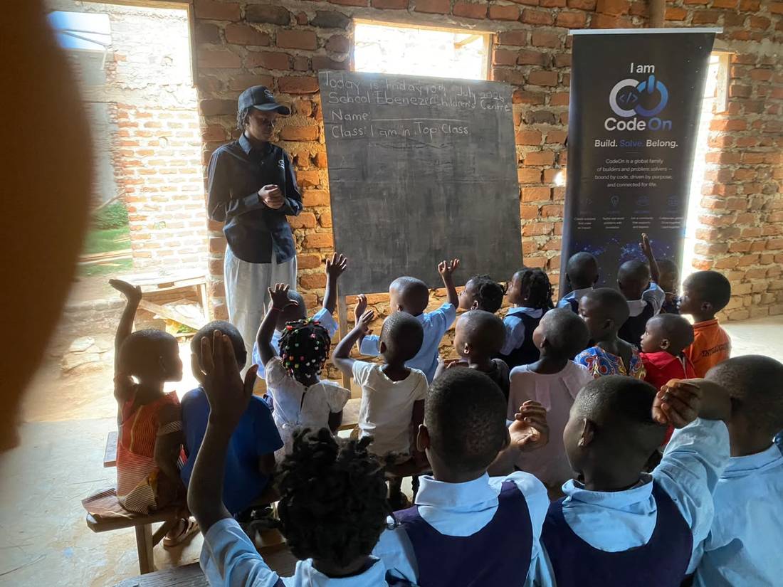 A teacher at the chalkboard at Ebenezer Children's Centre