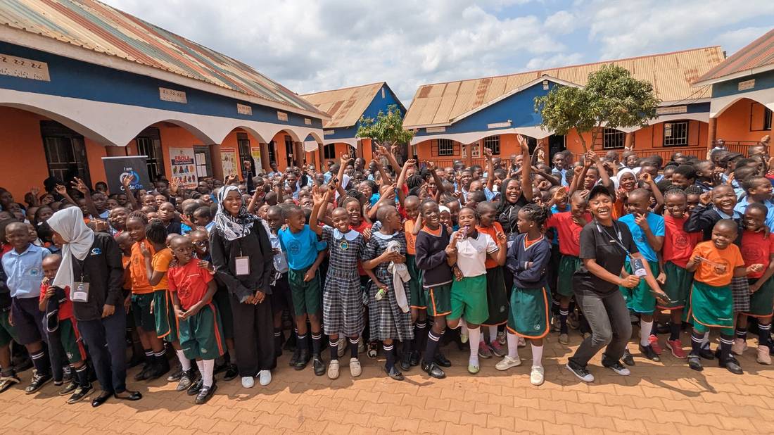 Students cheering at a CodeOn school outreach event
